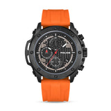 Gunmetal black watch with a black dial, three subdials, and a date window, paired with a bright orange silicone strap.