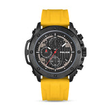Gunmetal black watch with a black dial, three subdials, white markers, red accents, and a yellow silicon strap.