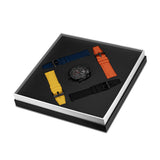 Black chronograph watch with a black dial and three interchangeable silicone straps in blue, orange, and yellow, plus a black