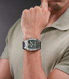Rectangular silver-toned stainless steel watch with a textured green dial, white markers, three subdials, and a black silicon
