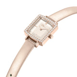 Rectangular rose-gold-toned watch with a crystal-encrusted bezel, light pink dial, and a slim light pink leather strap.