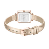 Back view of a rose-gold-toned square watch with a silver-toned caseback and a light pink leather strap with a rose-gold-tone