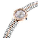 Rose gold-toned watch with clear stone bezel, mother-of-pearl and silver-toned dial, blue crown, and two-toned silver and ros