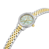 Silver and gold-toned watch with crystal bezel, light green mother-of-pearl dial, crystal markers, and gold-toned hands.