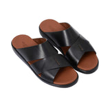 Angled top-down view of the pair showing the "Made in Italy" gold-leaf branding on the tan leather footbed.