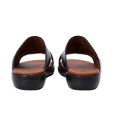 Heel view of PRESTIGE sandals highlighting the "PRESTIGE" branding embossed on the back of the white wedge sole.