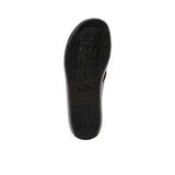 Bottom of the sandal showing the black rubberized outsole with a repeating "P" logo tread pattern for slip resistance.