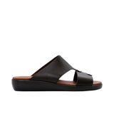 Profile shot of a brown leather Prestige sandal showing the thick black ergonomic sole and cognac brown footbed.