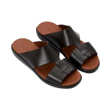 Top-down angled view of the sandals showcasing the smooth leather texture and "Made in Italy" gold-leaf stamping on the insole.