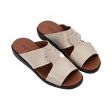 Angled top-down view of the pair of black leather slides, showcasing the "Prestige Made in Italy" gold-stamped logo on the tan insole.