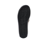 The bottom of the sandal featuring a textured, non-slip black rubber grip with embossed Prestige branding patterns.