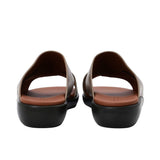 Heel view of PRESTIGE sandals highlighting the "PRESTIGE" branding embossed on the back of the white wedge sole.