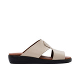 Side profile of a Prestige taupe leather men's slide sandal showing the thick black sole and tan footbed.
