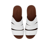Top-down angled shot of the leather slides showcasing the "Made in Italy" gold-leaf logo on the insole.