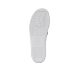 The bottom of the sandal featuring a textured, non-slip black rubber grip with embossed Prestige branding patterns.
