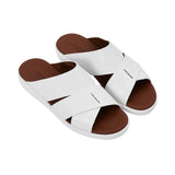 Angled top-down view of the pair showing the "Made in Italy" gold-leaf branding on the tan leather footbed.