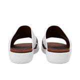 Heel view of PRESTIGE sandals highlighting the "PRESTIGE" branding embossed on the back of the white wedge sole.