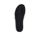 The bottom of the sandal featuring a textured, non-slip black rubber grip with embossed Prestige branding patterns.
