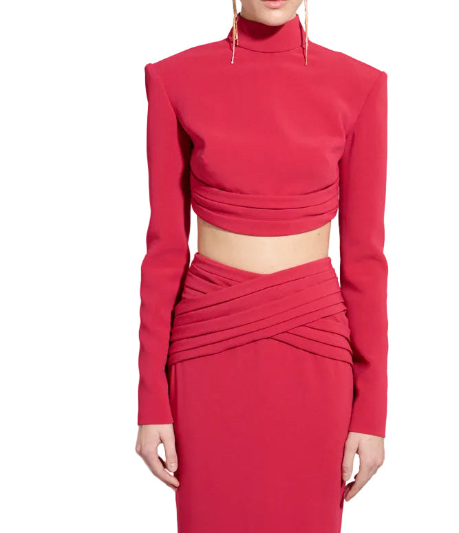 Persian red high neck long sleeve crop top with ruched hem and padded shoulders.