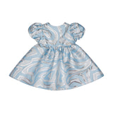 Light blue baby dress with silver abstract swirl pattern, puff sleeves, and gathered waist.