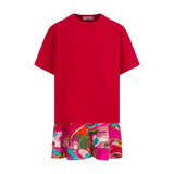 Red short-sleeved dress with a plain knit top and a ruffled skirt featuring a vibrant abstract swirl pattern in pink, orange,
