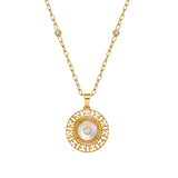 A detailed macro studio shot of the Escada Naomi necklace front, highlighting the concentric rings of the golden medallion, the repeating EE monogram cutouts, the iridescent Mother of Pearl ring, and the bezel crystal stations on the chain.
