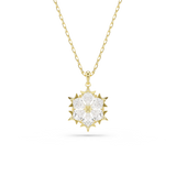 A direct frontal product view focusing sharply on the Swarovski Magic snowflake pendant, emphasizing the geometric symmetry of the mixed-cut crystals and the gold starburst frame points.