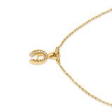 A close-up studio view of the Cerruti 1881 Amalia necklace pendant, showcasing the precision-set clear crystal pavé row on the interlocking gold loops.