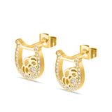 Detailed close-up shot of the Camilla earrings, highlighting the brilliant alignment of the clear crystal pavé setting alongside the polished gold loops.