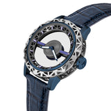 Three-quarter studio perspective highlighting the multi-tiered hollowed bezel architecture, the deep blue case wall finish, and the oversized fluted crown with the logo emblem.
