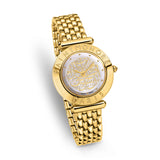 Three-quarter studio perspective highlighting the flat engraved gold bezel profile, the fluted crown, the iridescence of the white dial, and the flexible drape of the yellow gold bracelet.