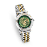 Three-quarter studio perspective highlighting the flat engraved bezel profile, the fluted crown, the iridescence of the green dial, and the flexible drape of the two-tone silver and gold bracelet.