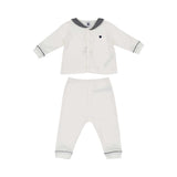 Petit Bateau baby pajama set in white with a navy striped sailor collar, button-up top, and matching long pants with navy piping.
