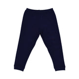 A two-piece Petit Bateau pajama set with a white long-sleeved top featuring red raglan sleeves and a large blue graphic print with a sailboat, paired with solid navy blue trousers.