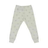 beige-colored two-piece Petit Bateau pajama set for girls with an all-over silver glitter heart pattern and ribbed ankle and wrist cuffs.