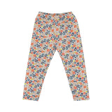 A two-piece Petit Bateau girls' pajama set featuring a short-sleeve top and long pants with a dense coral and blue floral pattern on a white background.
