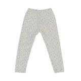girls' two-piece white pajama set from Petit Bateau with a colorful mini-dot pattern, featuring a long-sleeve top with a gathered neckline and matching leggings.