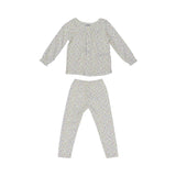 Girls' two-piece white pajama set from Petit Bateau with a colorful mini-dot pattern, featuring a long-sleeve top with a gathered neckline and matching leggings.