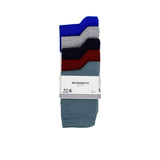 A 5-pack of Petit Bateau "Mes Chaussettes" socks in blue, grey, navy, burgundy, and slate blue, packaged with a white branded paper band.