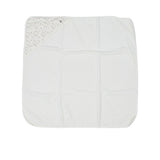 A white square cotton terry baby towel from Petit Bateau featuring a corner hood with a multicolored floral print and a small logo.