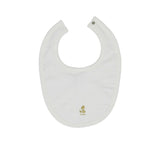 A white organic cotton baby bib from Petit Bateau featuring an all-over beige teddy bear pattern and a snap button fastener.
