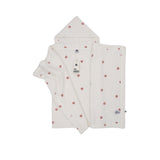 Petit Bateau off-white hooded baby towel with red heart embroidery, folded to show the triangular hood and plush texture.