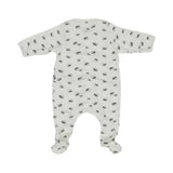 An off-white long-sleeve baby sleepsuit with feet, featuring an all-over small grey hedgehog print and snap button closures.