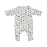 An off-white long-sleeve baby sleepsuit with feet, featuring an all-over small grey hedgehog print and snap button closures.
