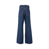 Rear view of Philipp Plein wide-leg denim trousers showing two large back pockets and a small black hexagonal "PP" logo patch on the right pocket.