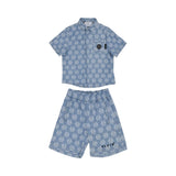 Front view of a blue Philipp Plein Junior shirt and shorts set featuring a white hexagonal logo monogram and diamond pattern.