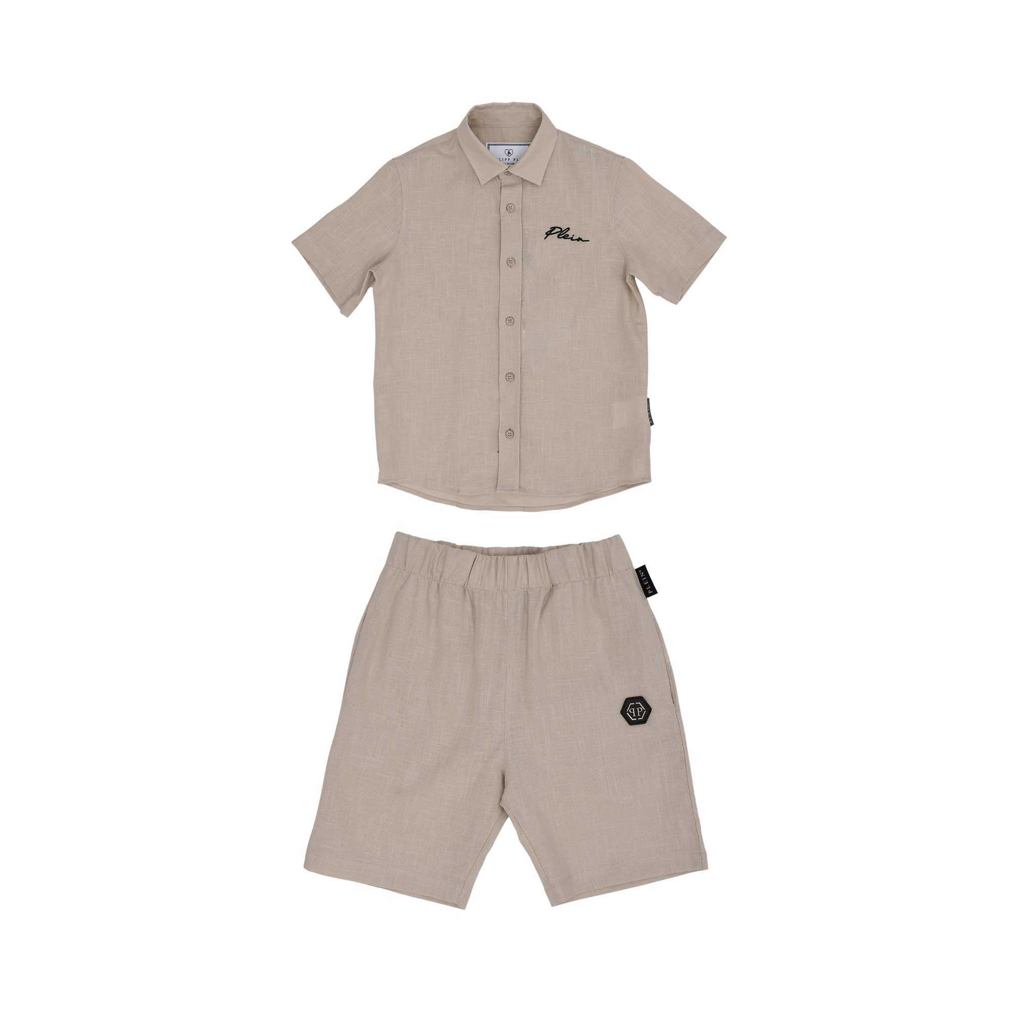 Front view of a beige Philipp Plein Junior shirt and shorts set made from linen, featuring black script branding and a logo patch.