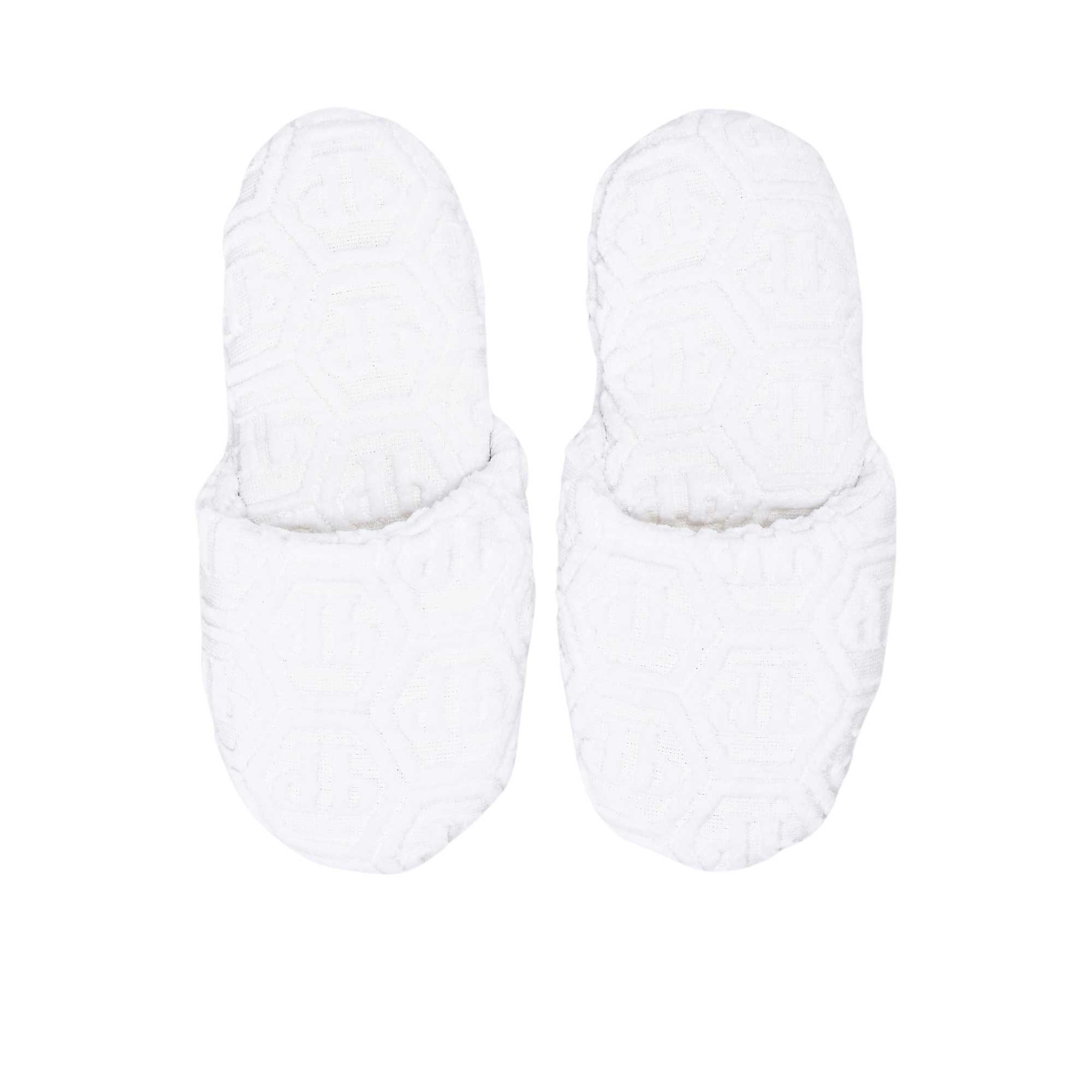 A direct top-down view of a pair of white Philipp Plein terry slippers, displaying the hexagonal monogram on the insole and upper.