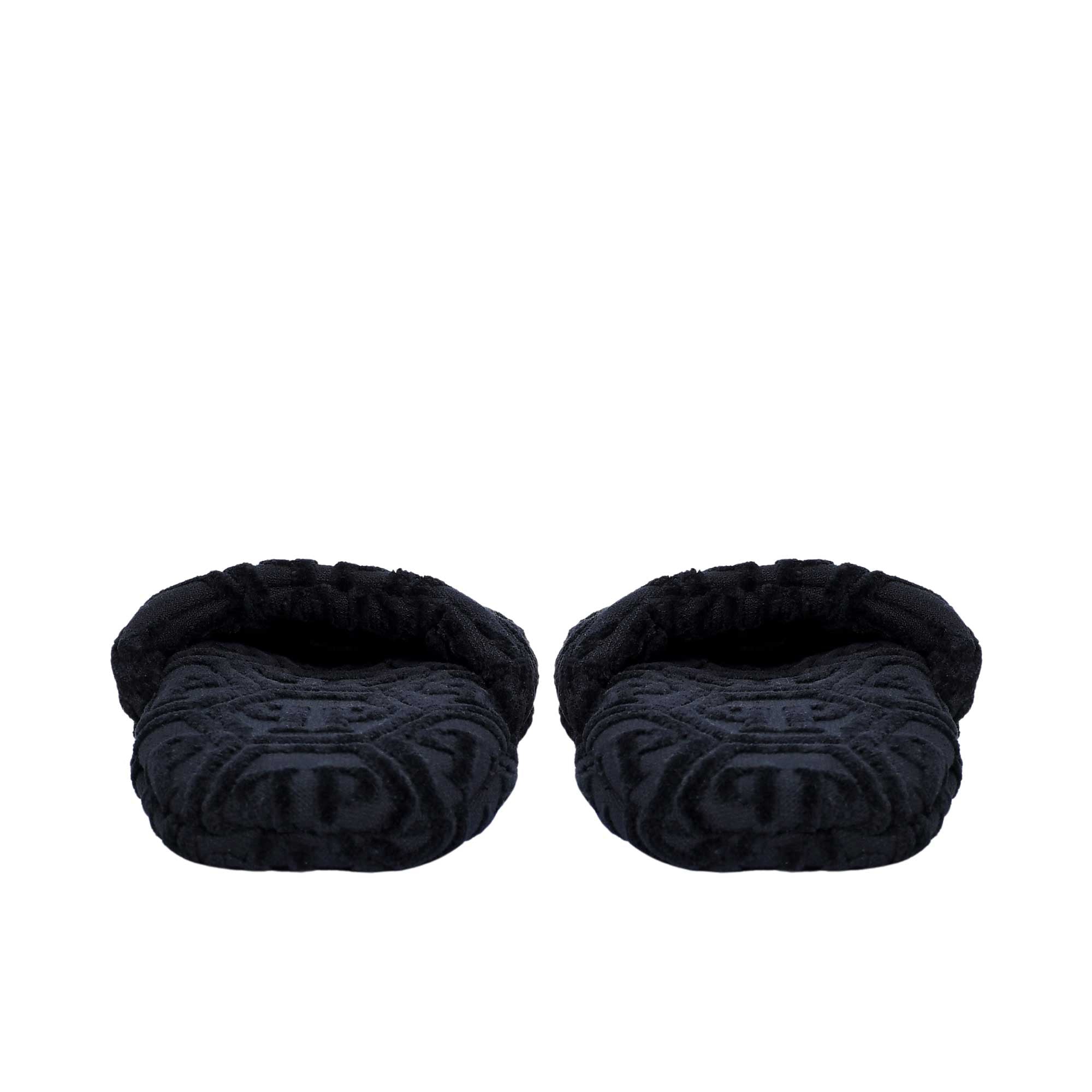 The front  pair of black terry slippers, revealing the padded interior and the repeating logo design.