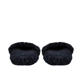 The front  pair of black terry slippers, revealing the padded interior and the repeating logo design.